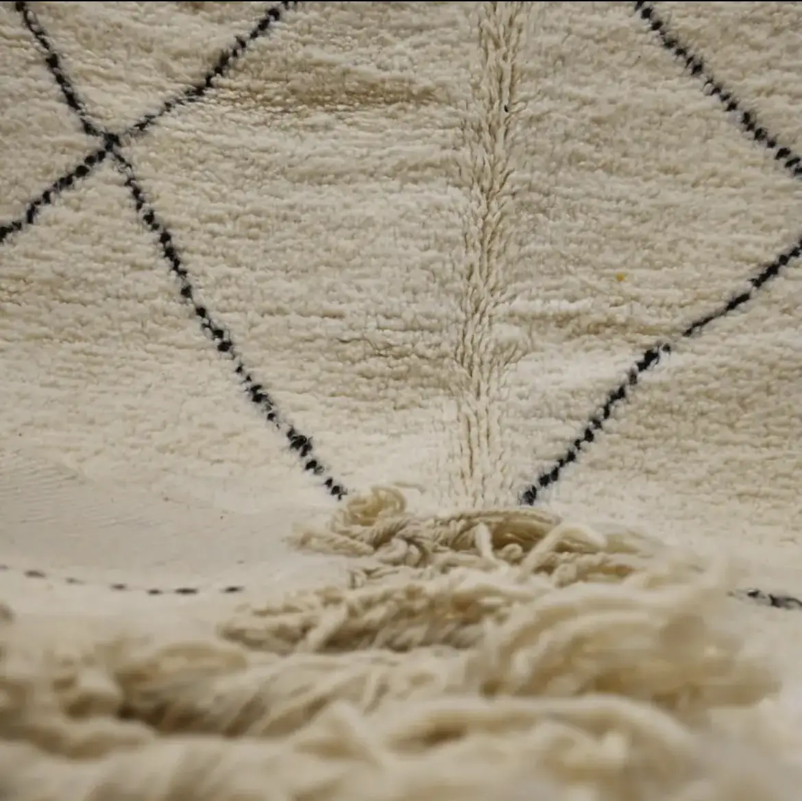 Elegance and Berber craftsmanship come together in this Beni Ourain rug. A wool Berber rug that will enhance your space with its authentic design