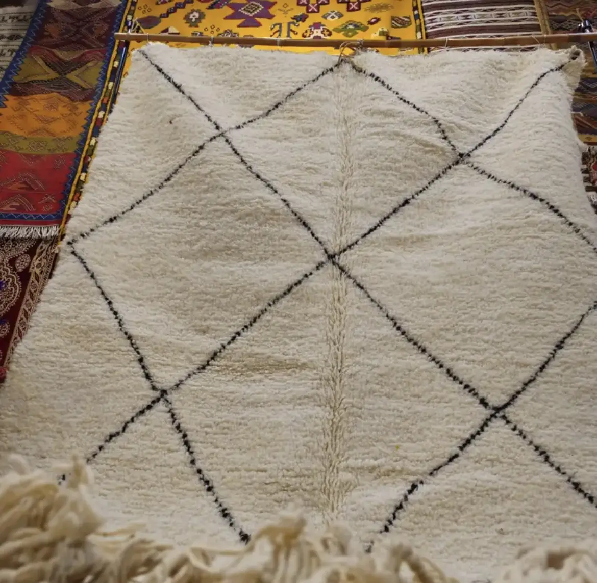 Elegance and Berber craftsmanship come together in this Beni Ourain rug. A wool Berber rug that will enhance your space with its authentic design