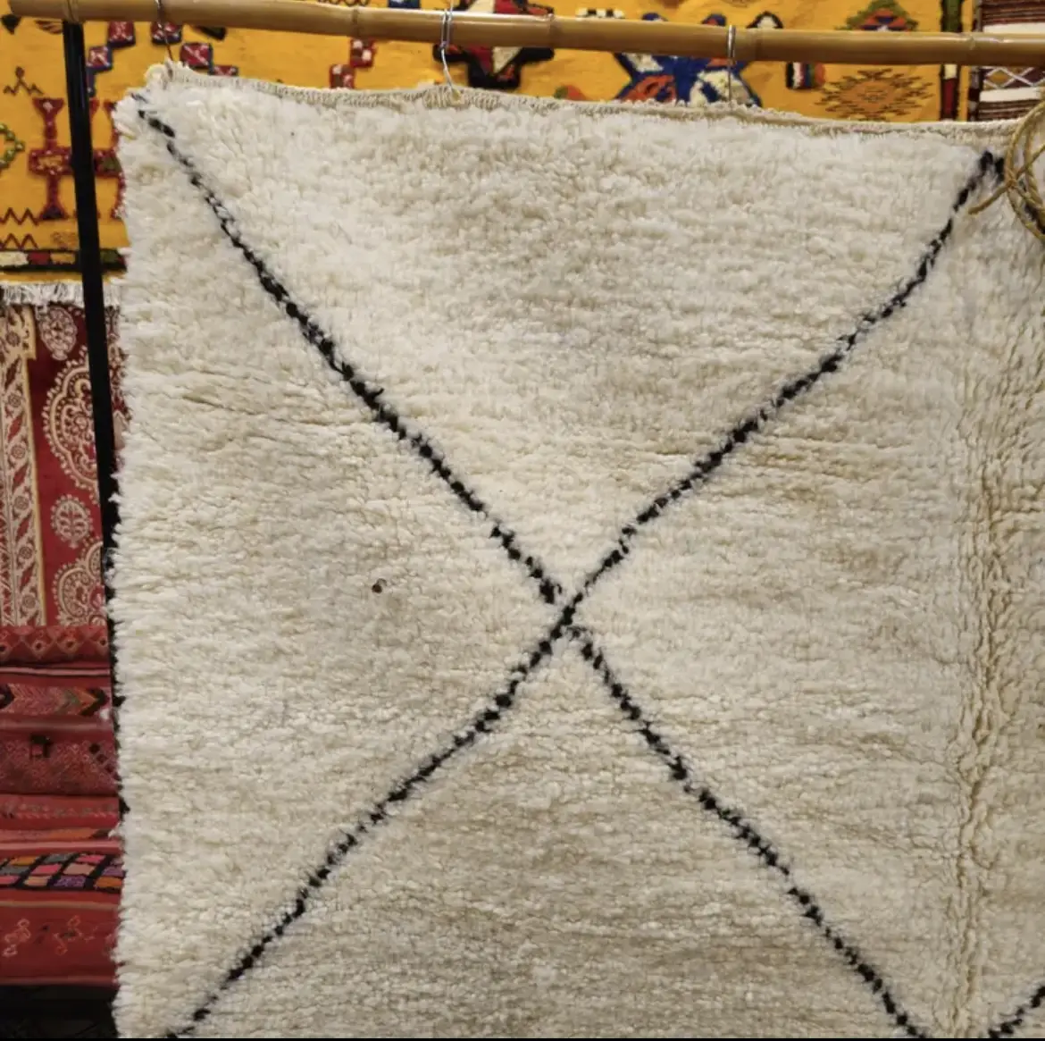 Elegance and Berber craftsmanship come together in this Beni Ourain rug. A wool Berber rug that will enhance your space with its authentic design